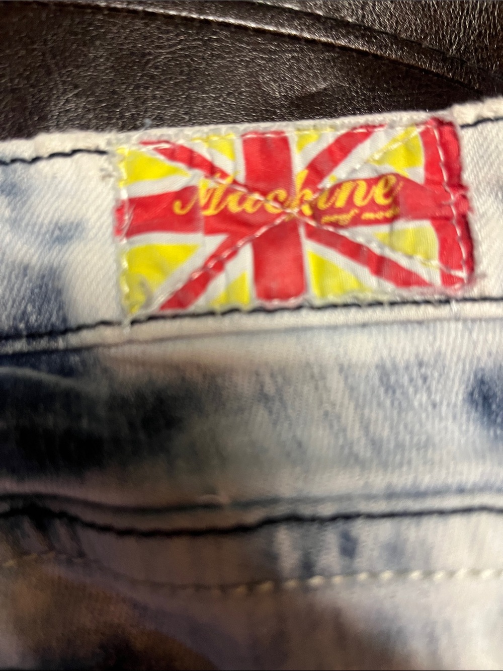 Y2k Machine Jeans featuring a heavily distressed, bleached acid-wash design 29